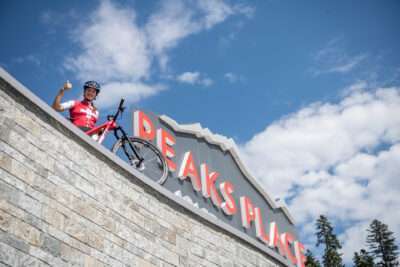 The logo of Peaks Place in Laax and young talent Lorena Cadalbert